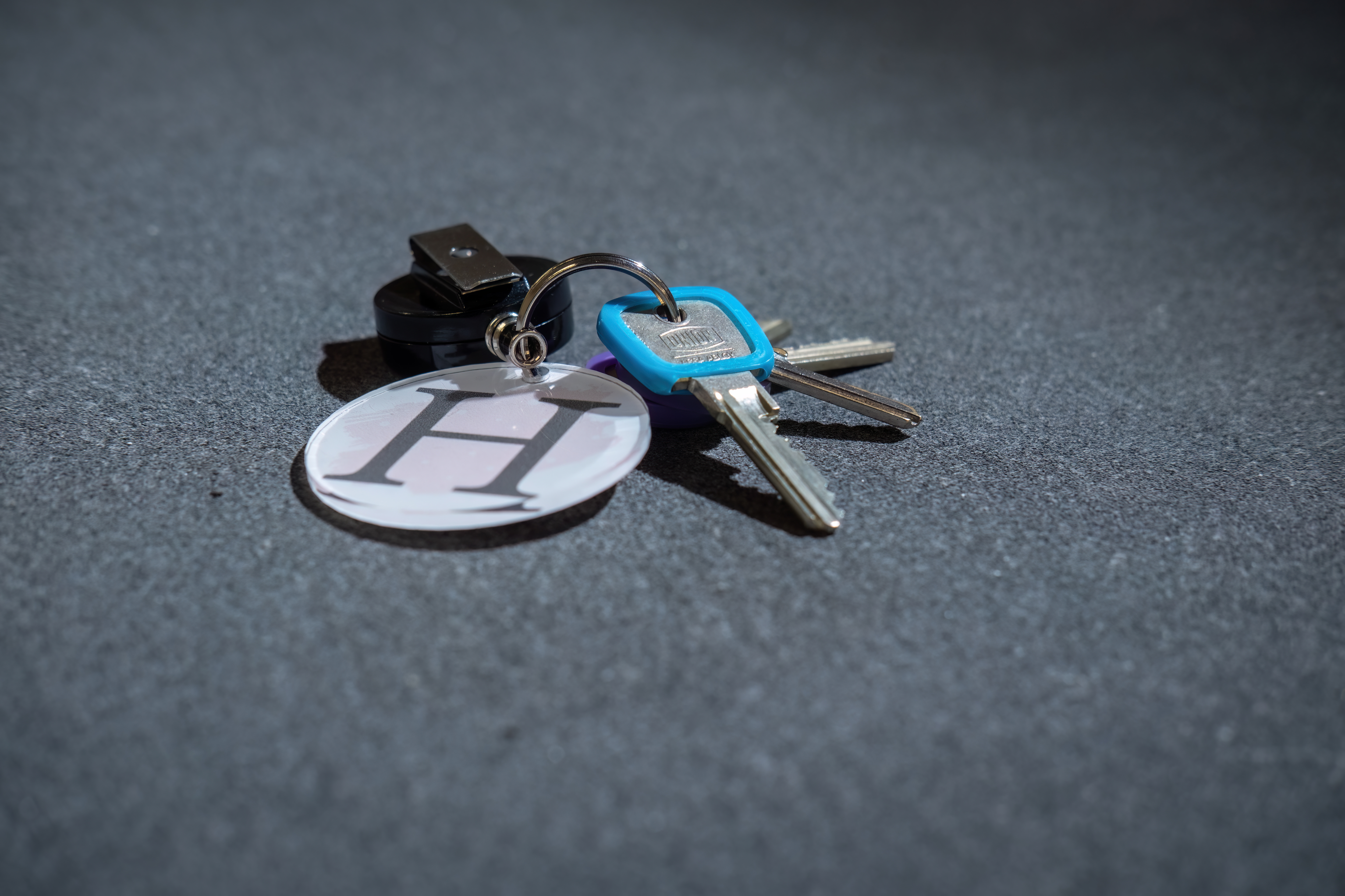 a sample die cut key fob on a table. Key fob made from lumex a